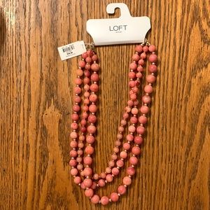 Loft pink beads with gold detail spacers.